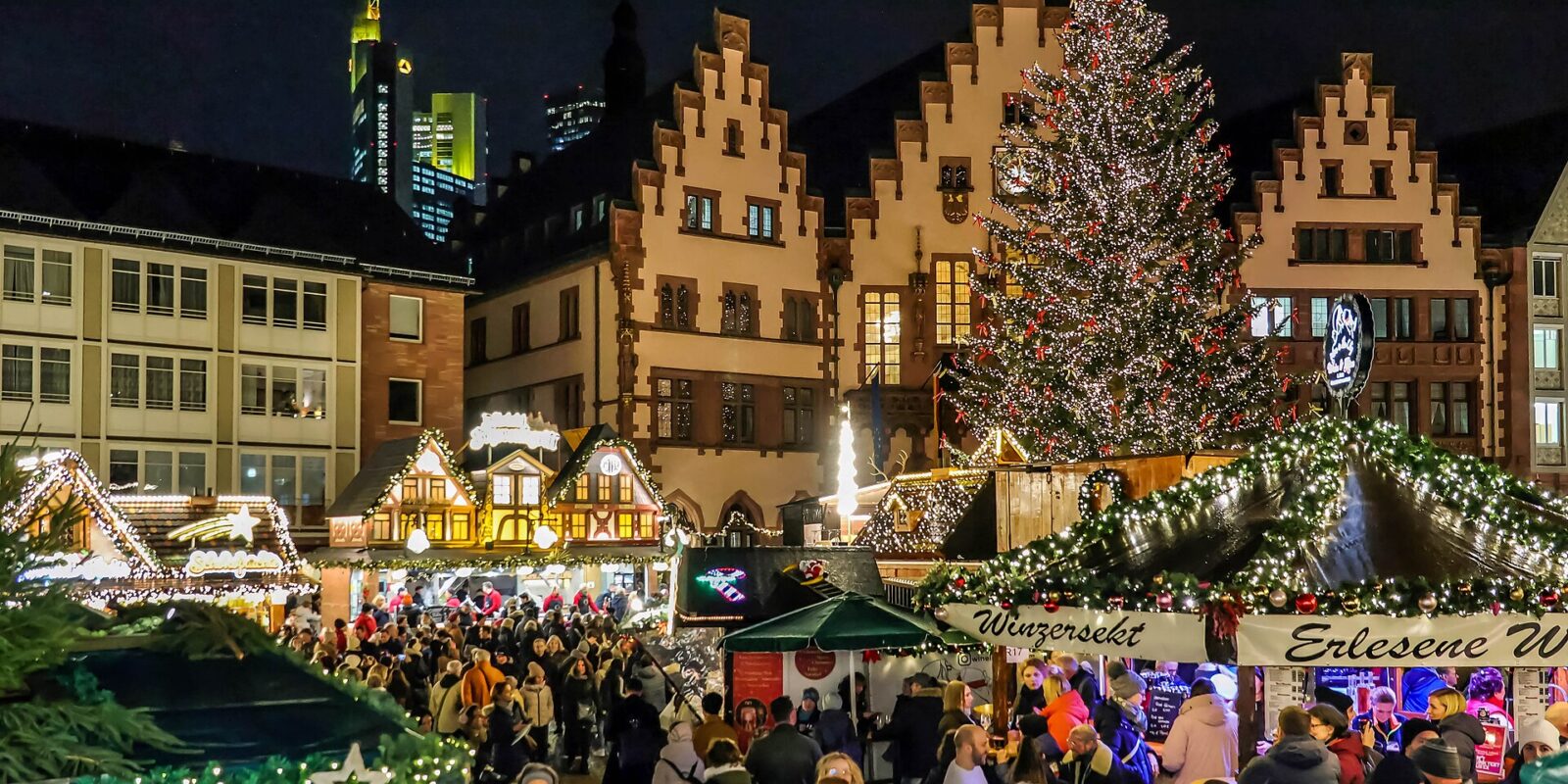 The Römerberg in Frankfurt at night, with the Christmas tree and market stalls in front of the half-timbered houses