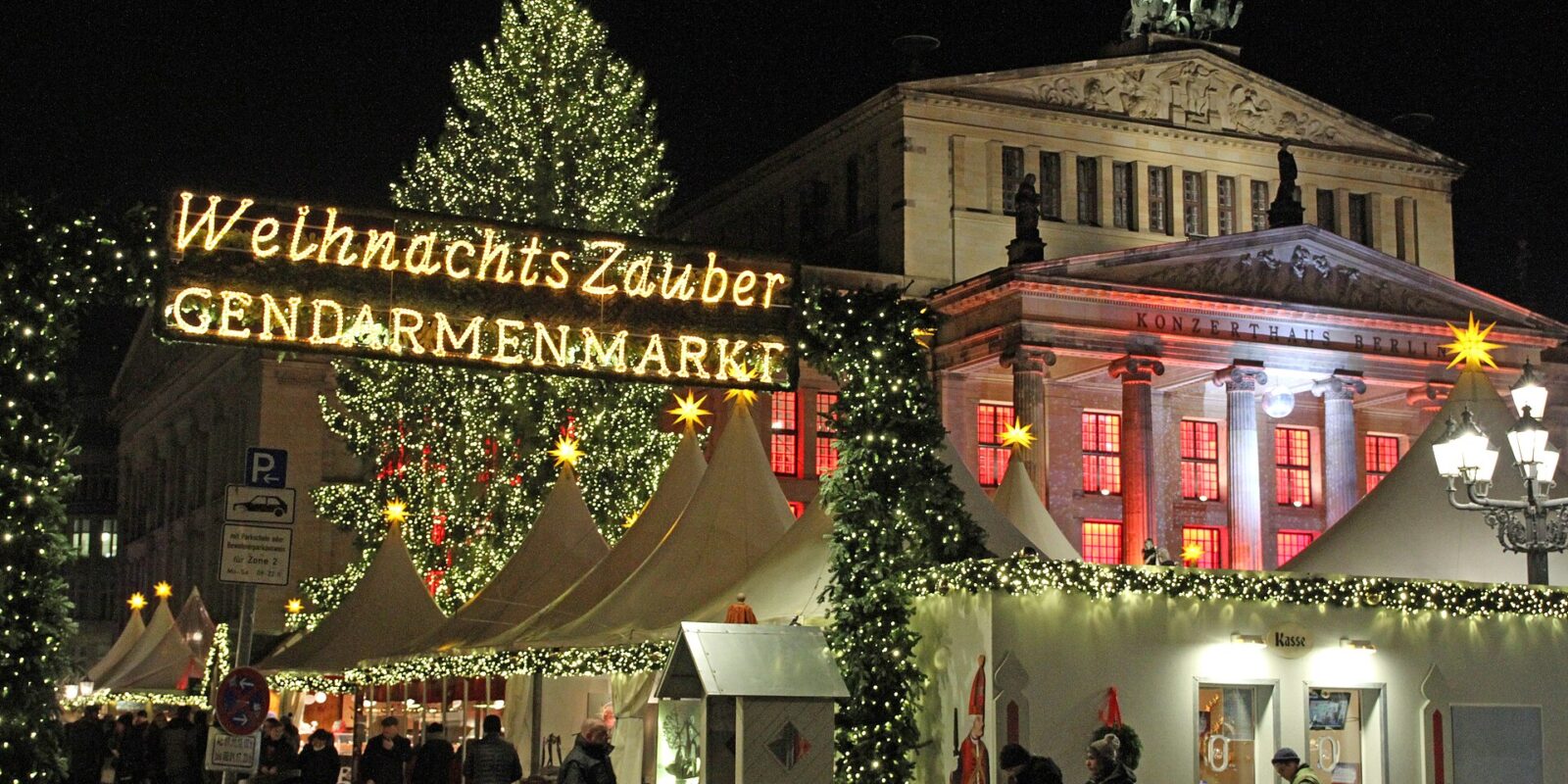 The WeihnachtsZauber sign, Christmas tree and white tents in front of the Konzerthaus on Berlin's Gendarmenmarkt